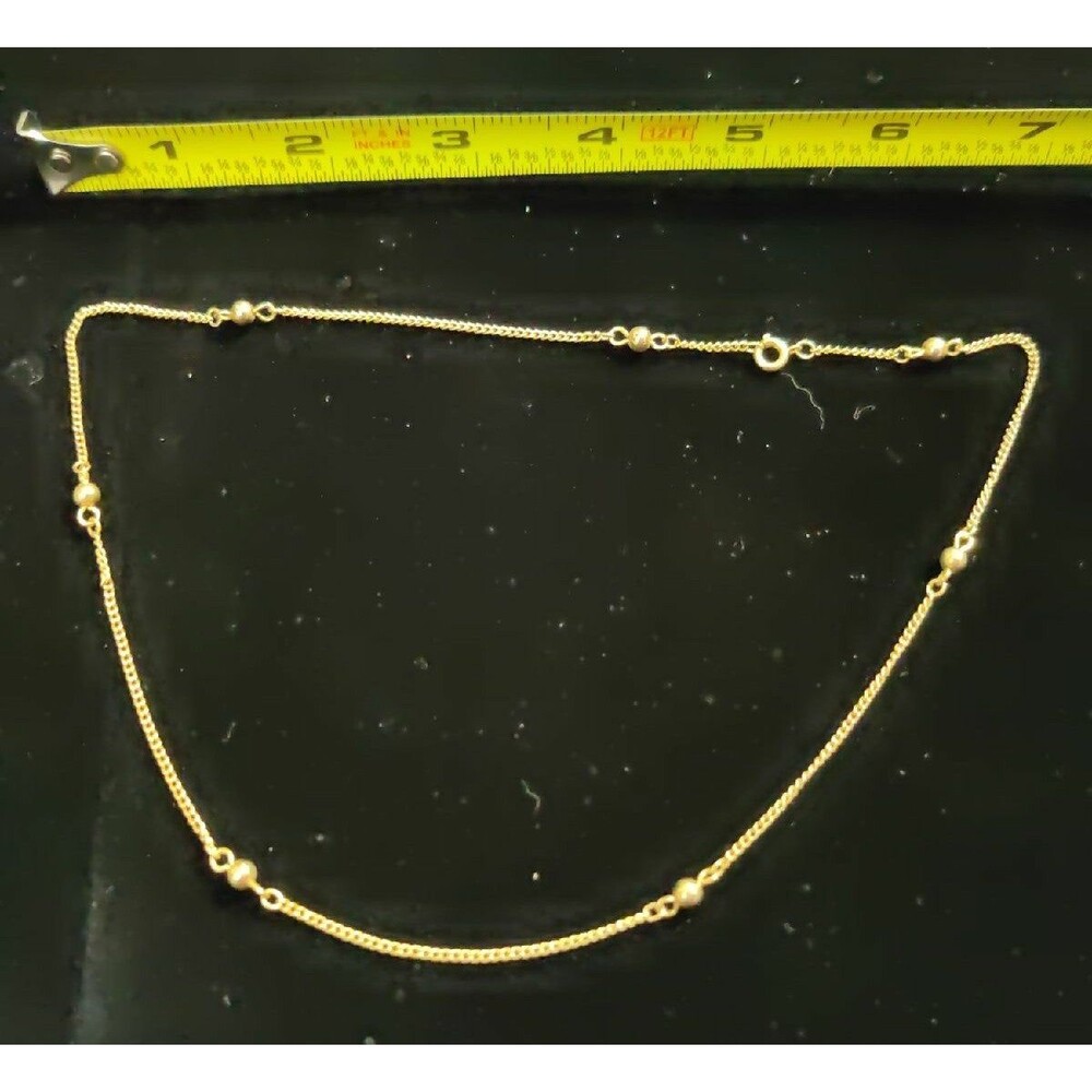 Gold tone chain and balls Necklace